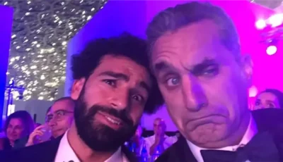 حد لاقي دلع وما يتدلعش والبلد كلها شايلاه فوق دماغها، باسم يوسف يهاجم منتقدي انتقال صلاح إلى طرابزون (فيديو)